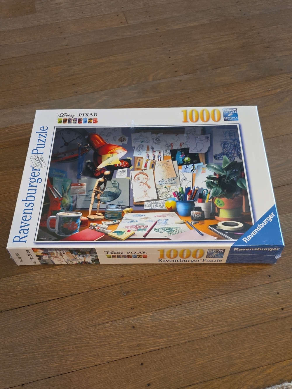 Ravensburger Pixar Artist Desk Puzzle with Red Lamp and Blue Accents